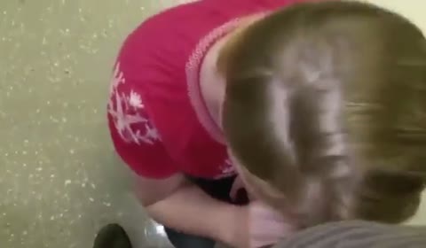 A mature woman in an empty hallway received a juicy cumshot