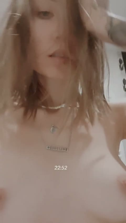 The girl shows herself and bites her lips