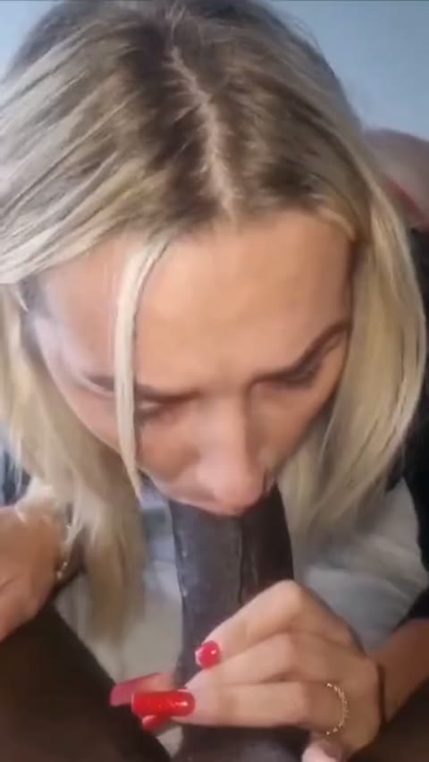 Beautiful woman sucks a black man’s penis